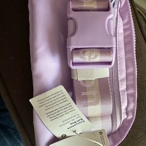2 of this -new with tags Lululemon lavender Belt Bags - Sleek as shown 2 pieces